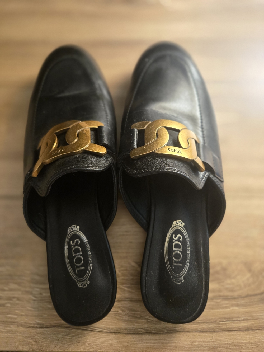 Tod's Black Leather Backless Loafers with Gold Chain Accent